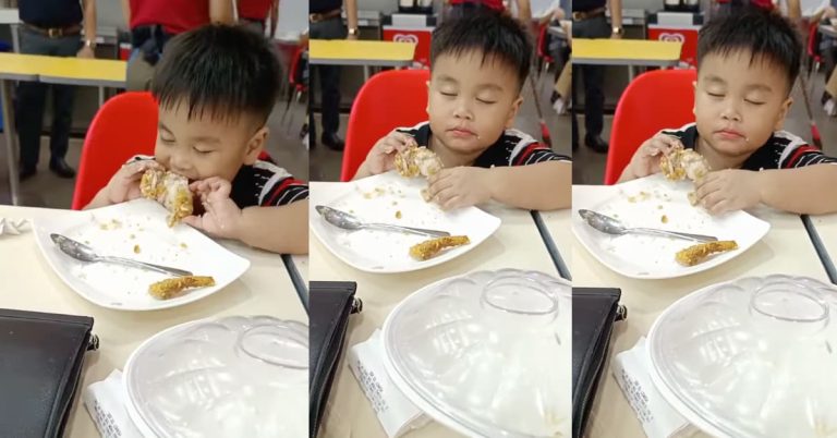 Sleepy toddler struggles to stay awake while eating fried chicken